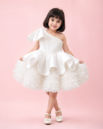 White one-shoulder princess party dress for girls with voluminous layered tulle skirt and elegant flared silhouette