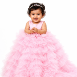 Pink princess party dress for girls with layered tulle skirt and fluffy ruffle detailing