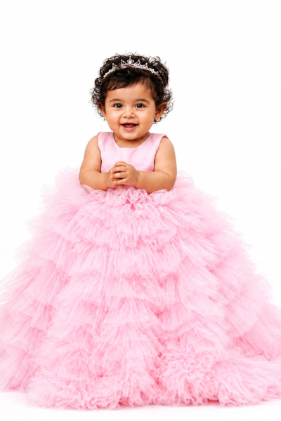 Pink princess party dress for girls with layered tulle skirt and fluffy ruffle detailing