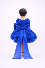 Royal blue girls party dress with puff sleeves, black sequin bow and layered flared skirt
