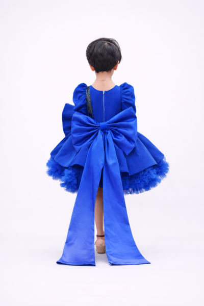 Royal blue girls party dress with puff sleeves, black sequin bow and layered flared skirt