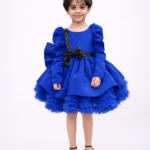 Royal blue girls party dress with puff sleeves, black sequin bow and layered flared skirt