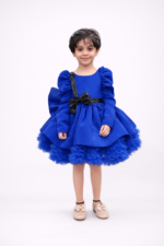 Royal blue girls party dress with puff sleeves, black sequin bow and layered flared skirt